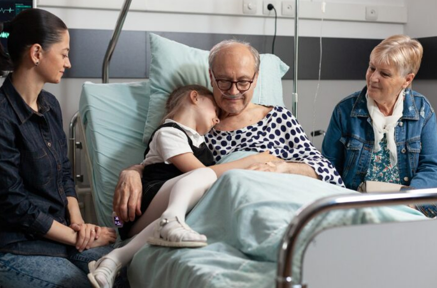 Family and hospice care coordinator talking at home about early hospice referral, symptom support, and care coordination for comfort-focused care